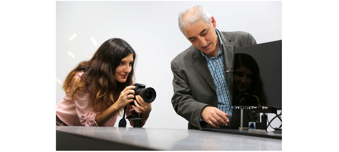 Woman taking a photo of a display